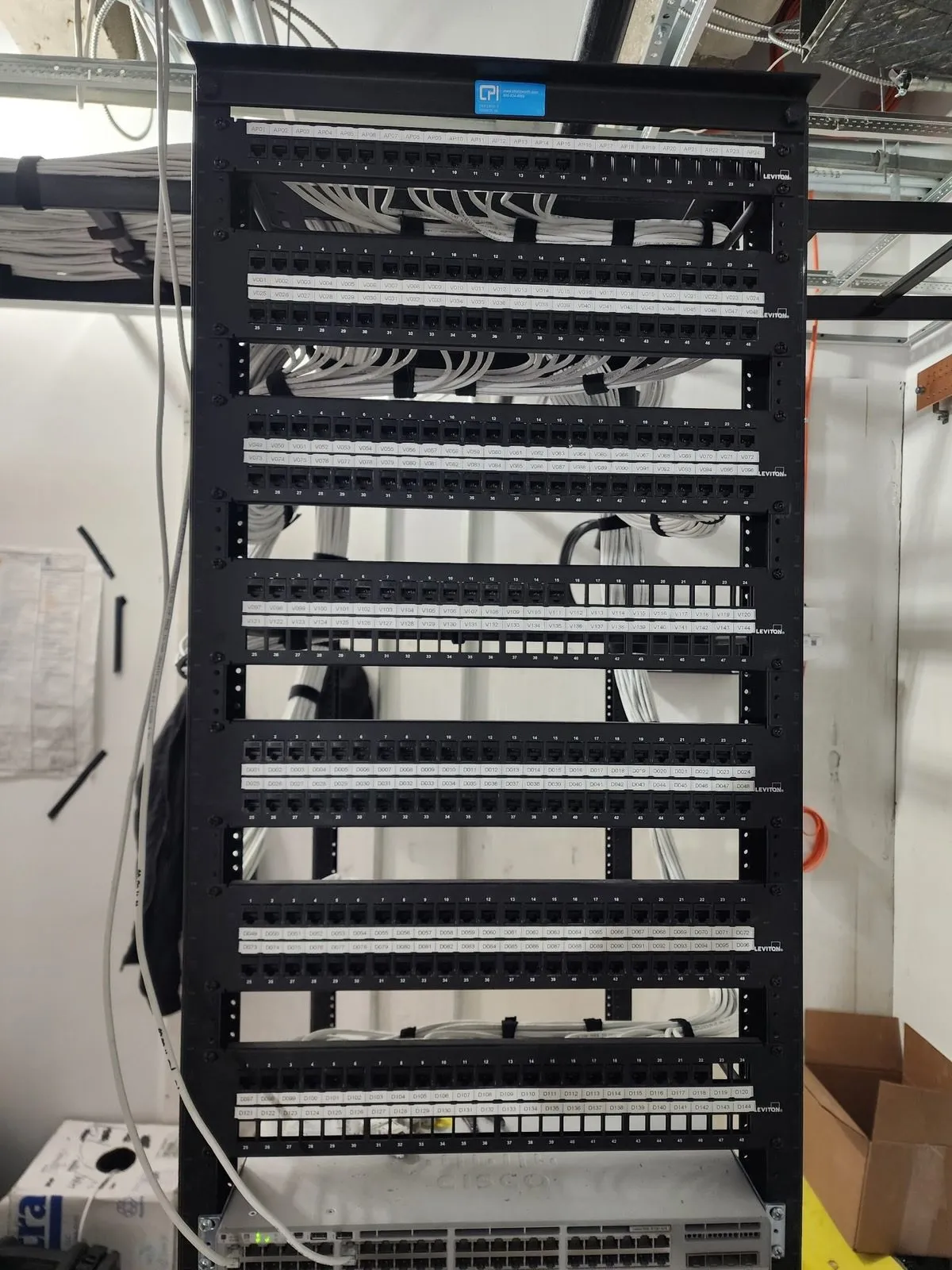 Structured cabling installation — Leviton patch panels in CPI rack with clean cable management