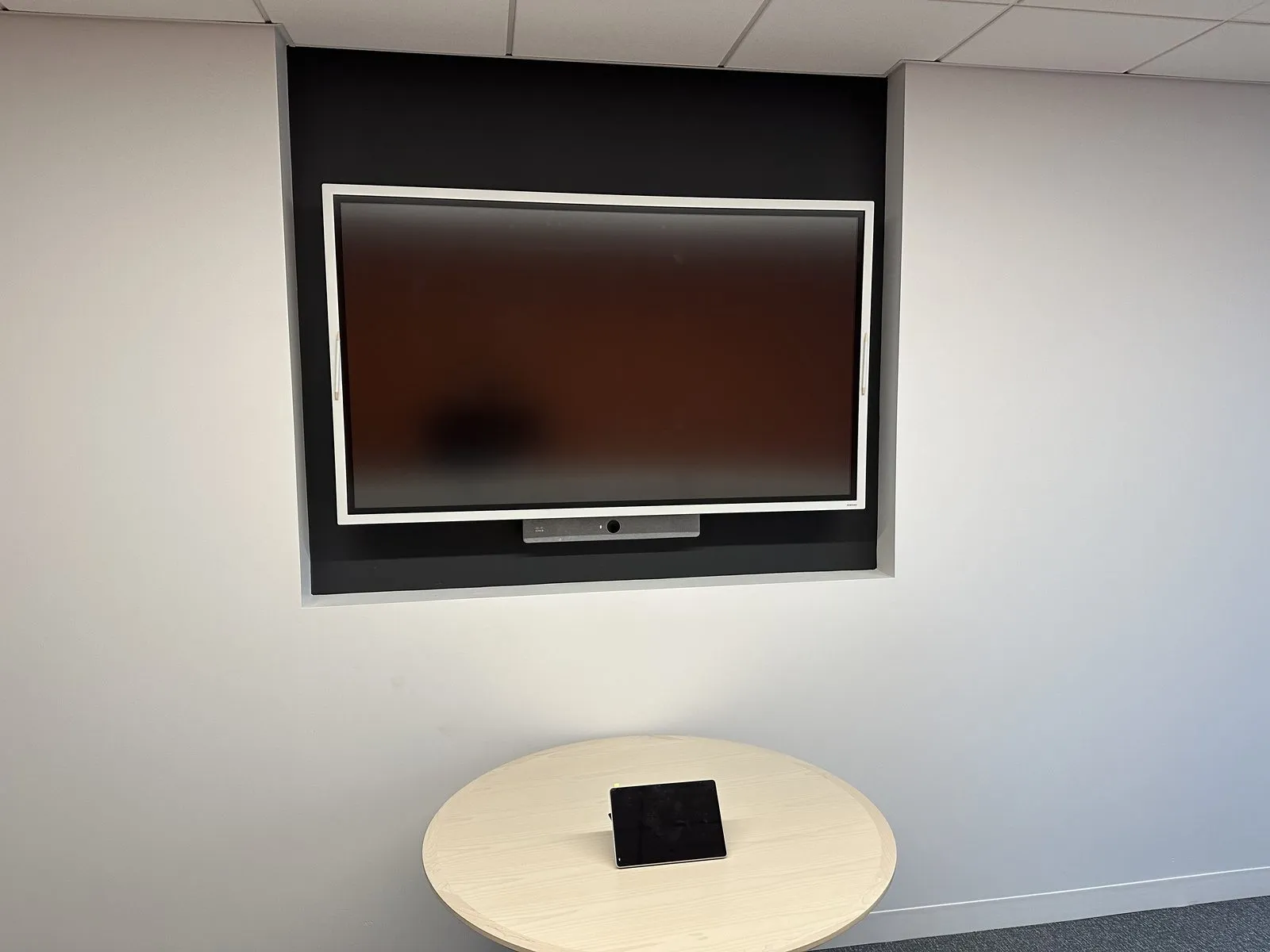 Webex Board installed in a huddle room for video conferencing and whiteboarding