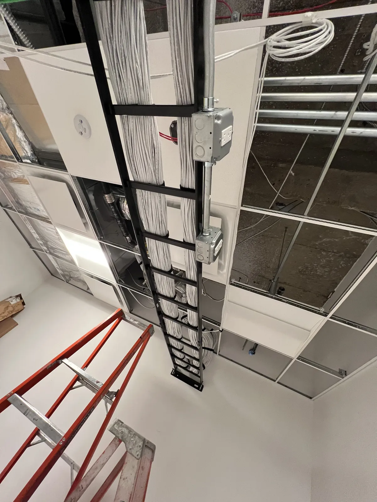 Smart home AV closet with glass-door server enclosure and wall-mounted equipment rack